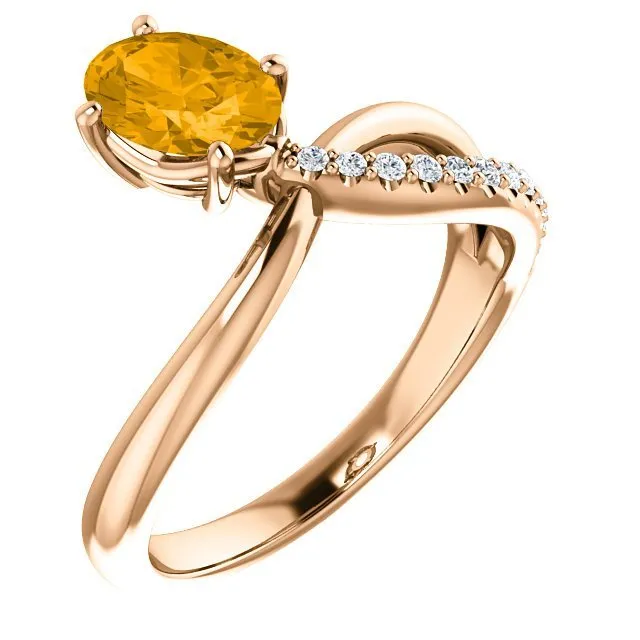 14KT GOLD 0.72 CT CITRINE & 1/10 CTW DIAMOND BYPASS RING