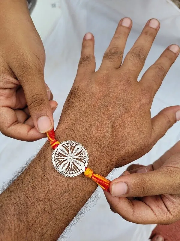 Blooming Aastha - Silver Rakhi