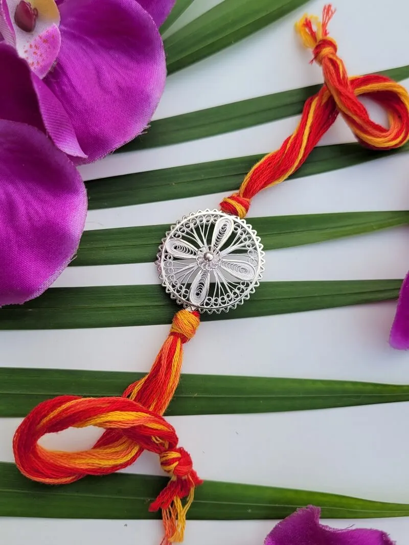 Blooming Aastha - Silver Rakhi